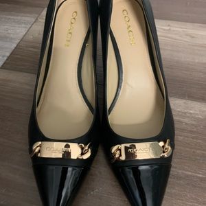 Coach black pointed toe pumps with gold coach nameplate